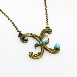 Кулон з латуні Michal Negrin у вигляді букви X з кристалами Swarovski 55450X фото